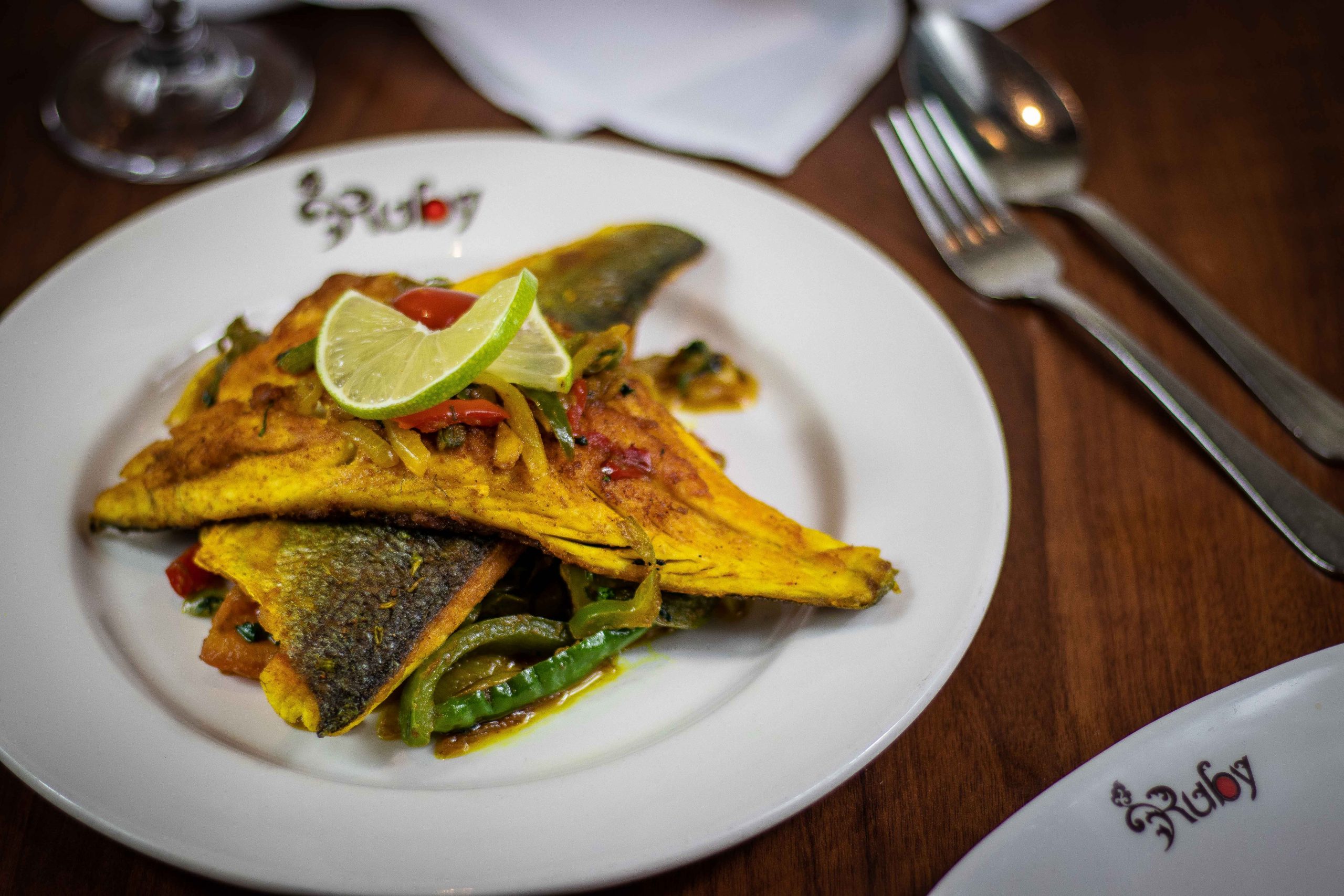A refined Ruby signature dish with bright herbs and citrus
