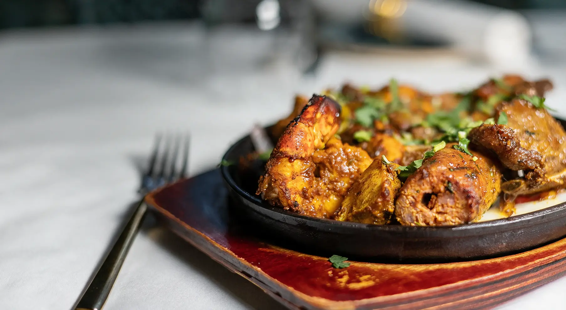 Ruby's tandoori selection served sizzling at the table